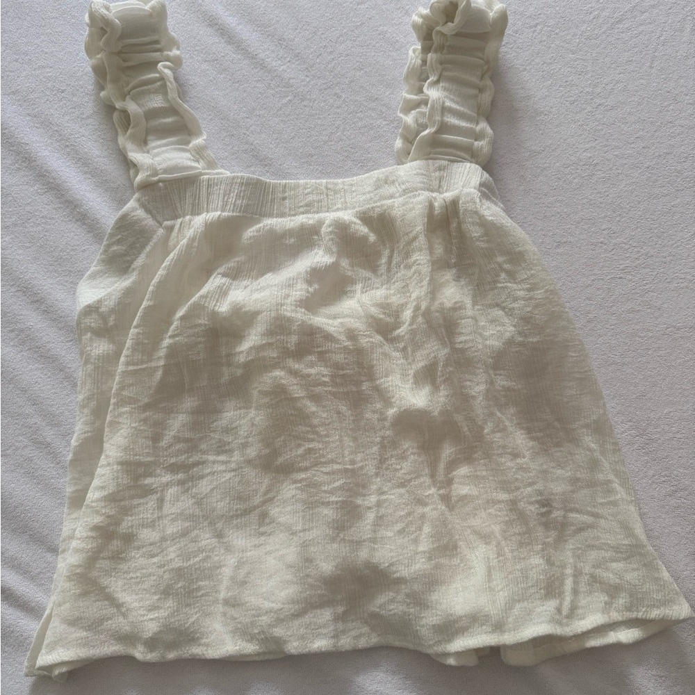 Elegant White Sleeveless Top with Ruffles